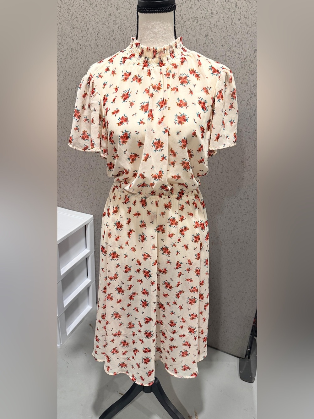 dress with a floral print and red roses